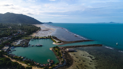 Fototapeta na wymiar Aerial view of fisherman village marina on the tropical island 