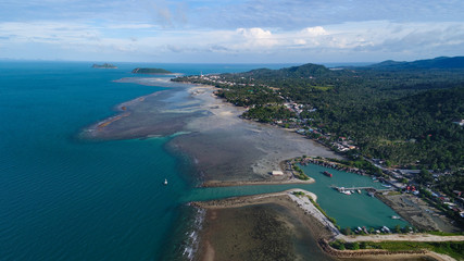 Obraz premium Aerial view of fisherman village marina on the tropical island 