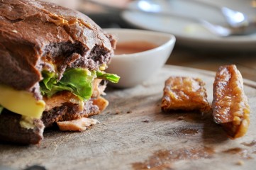 hamburger in a restaurant. Hamburger, beef and vegetables to bite one. junk food as concept.