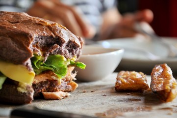 hamburger in a restaurant. Hamburger, beef and vegetables to bite one. junk food as concept.