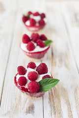Trifle sweet dessert with raspberries.
