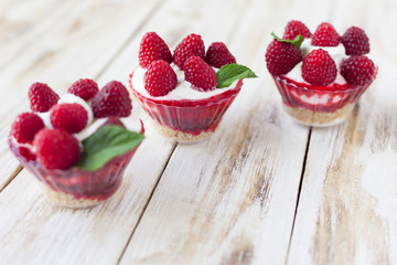 Trifle sweet dessert with raspberries.