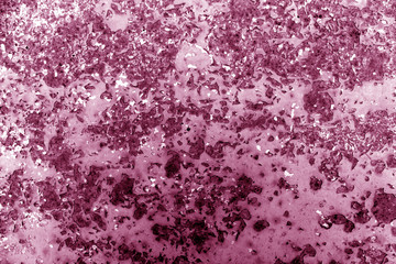Pink toned rusted metal surface.