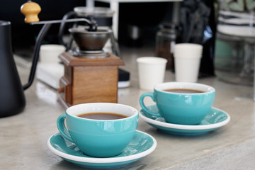 Fototapeta na wymiar Hot americano - Closeup a cup of coffee on concrete table background, Morning Breakfast.