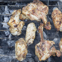Delicious chicken wings on a barbecue at picnic