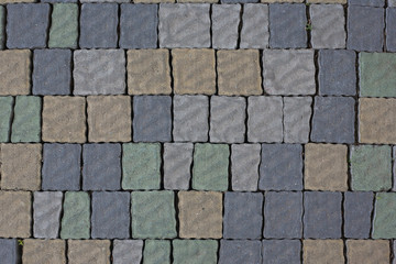 Renew multi-colored Stone paving texture. Abstract structured background of modern street pavement slabs pattern.