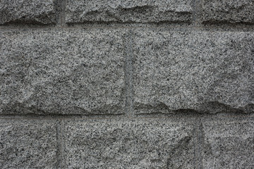 Closeup of grey granite texture background. Granite stone wall