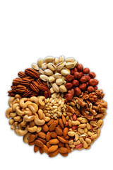 Assorted nuts in the form of a circle (peanuts, almonds, hazelnuts, pine nuts, cashews, walnuts, pistachio) on a white background