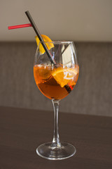 Alcohol bar, cocktail glass on the bar counter, cocktail glass in a bar. Drinking cocktails. Fresh drink cocktail on a color background.