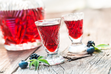 Fresh liquor with berry fruits and alcohol in summer