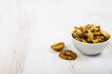 Walnuts on a  wooden table