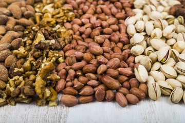 Nuts on a  wooden table.