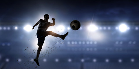 Fototapeta na wymiar Soccer player in action . Mixed media