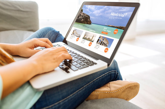 woman looking for a vacation on a laptop