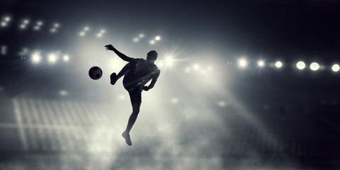 Fototapeta na wymiar Soccer player in action . Mixed media