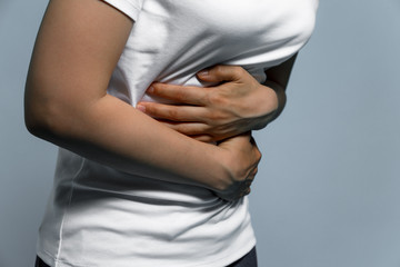 young woman having a stomachache.