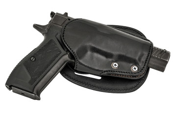 Molded leather holster with handgun. Isolated