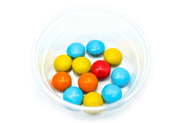 Rainbow Colorful Candy Coated Chocolate Pieces, isolated on a white background