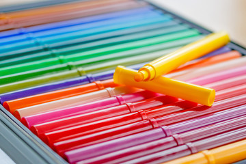 Color markers in the storage box closeup