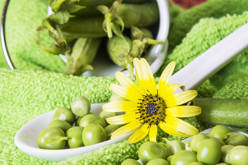 Spoon with green peas