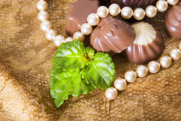 assortment of chocolates with Pearl Necklace
