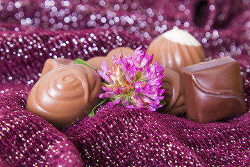 assortment of chocolates with flowers.