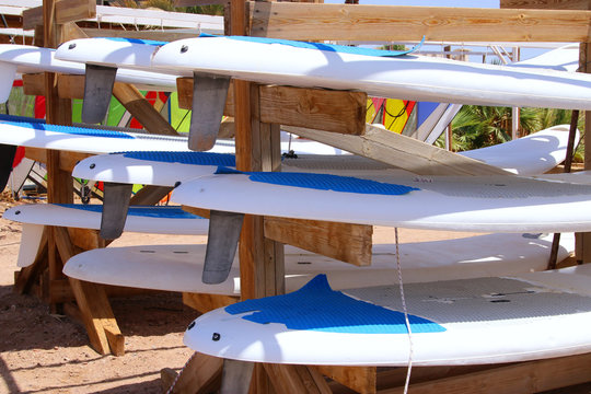 Closeup of surfboards are stored on the tropical beach