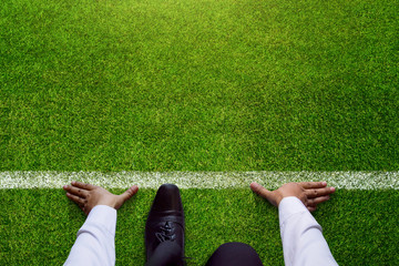 Start background, Top view of Businessman on Start line in soccer grass field, Business Challenge...