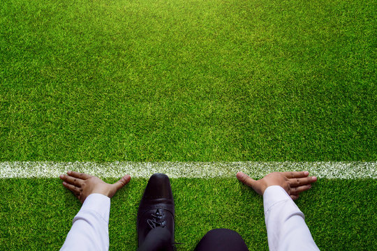 Start background, Top view of Businessman on Start line in soccer grass field, Business Challenge or do something new
