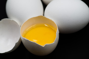 fresh eggs on the black background