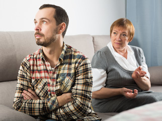 Elderly mother and son quarrel