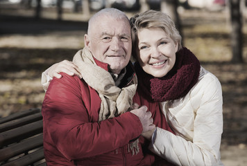 Mature couple sitting in park