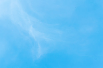 clear blue sky with plain white cloud with space for text