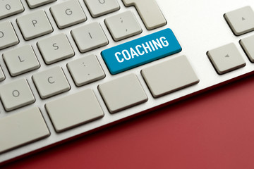 Computer key showing the word COACHING