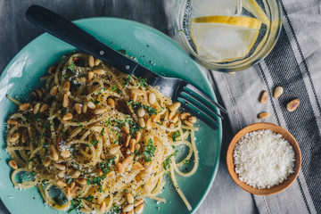 Spaghetti with pine nuts, butter and parsley.