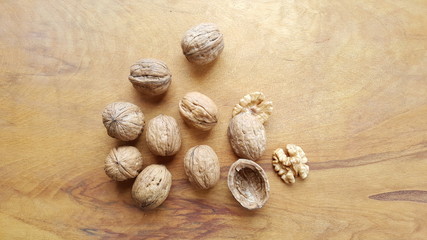 Fototapeta na wymiar walnut on wood background