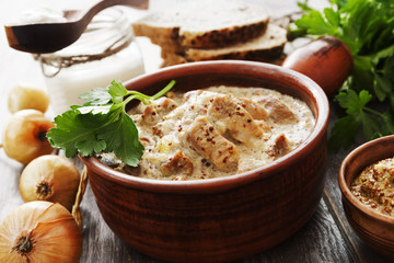 Stewed meat with mustard sauce in the bowl