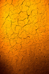 Clay wall in golden light as background