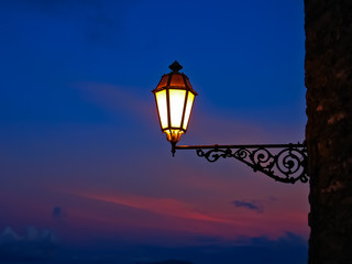 An old lantern in night Erice, Sicily, Italy. Romantic, mysterious image