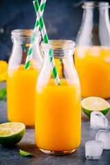 Mango orange juice with ice and lime