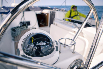 Close up of nautical compass on yacht