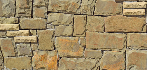 Rectangular stones wall from a natural stone background