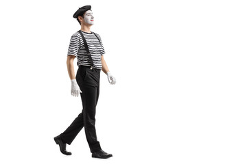 Full length profile shot of a mime walking
