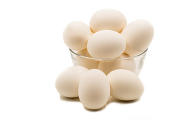 fresh brown egg on the white background