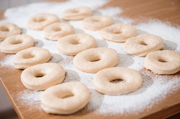Chef preparing dough - cooking donuts process