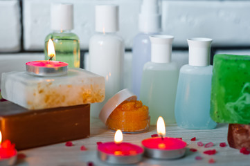 Bathroom accessories. Body care. Multi-colored natural soap, gels, shampoos, balms in vials, sea...