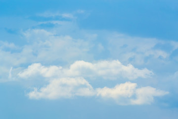 The sky is a small cloud floating in the sky.