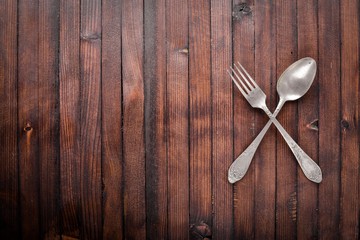 Old cutlery. On Wooden background. Top view.