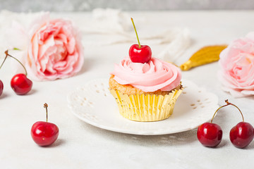 Pink cupcakes with roses and cherries. Festive and bright. Wedding Celebration concept.