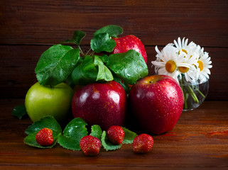 Still life with fruit on a wooden background